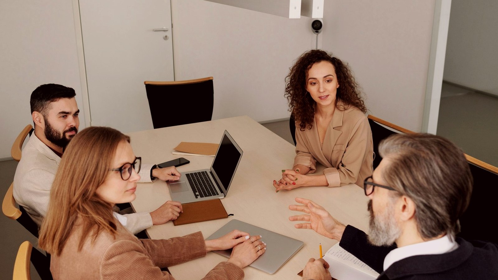 Professional people discussing event venue requirements